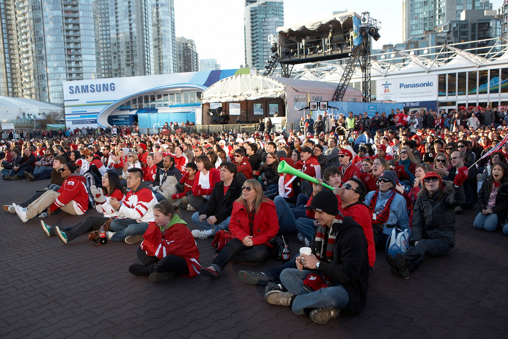 A crowd sitting on rubber interlock flooring at the Olympics, and ideal solution for comfortable flooring