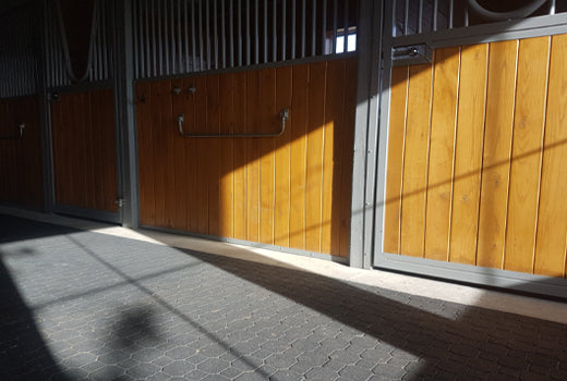 Rubber interlock flooring inside horse barn, ideal comfortable flooring solution