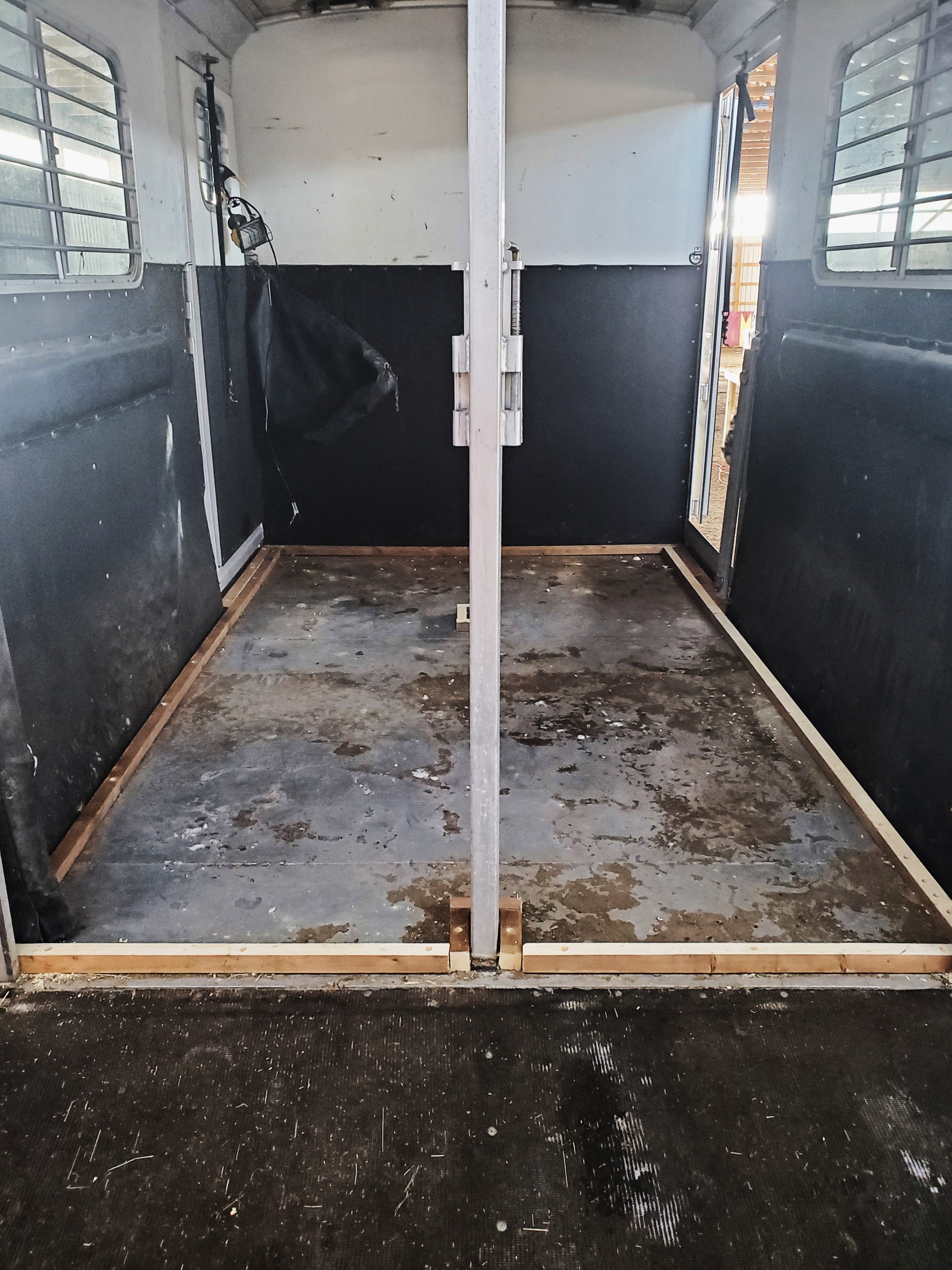 A stripped horse trailer with no padding